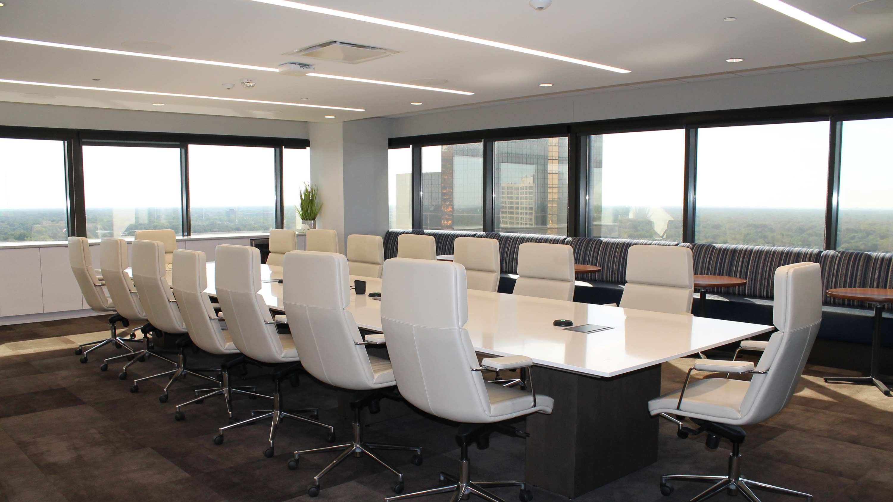 conference room, white chairs, windows, white table, led lighting